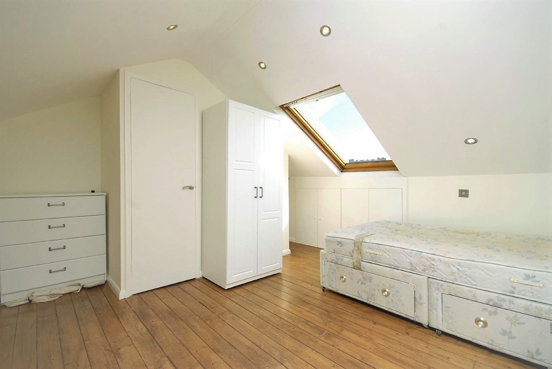 A nicely decorated bedroom loft area.